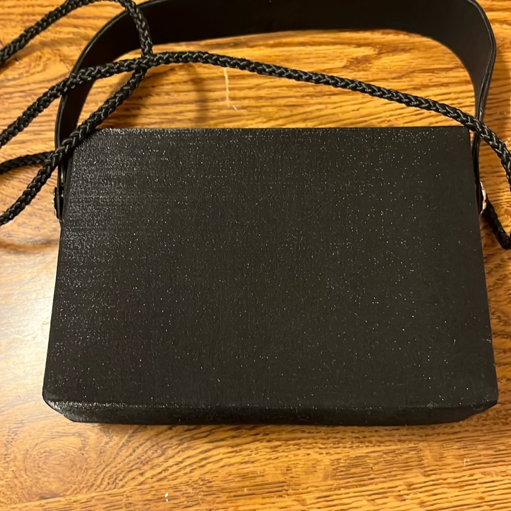 Small black Sasha satin evening bag with rope strap and rhinestone on handle